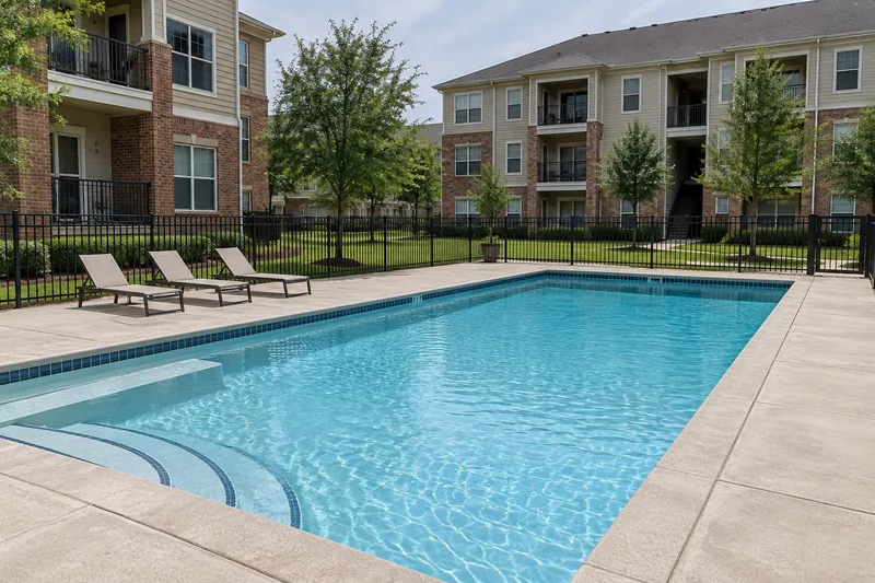 Apartment courtyard pool with a new finish between three-story buildings